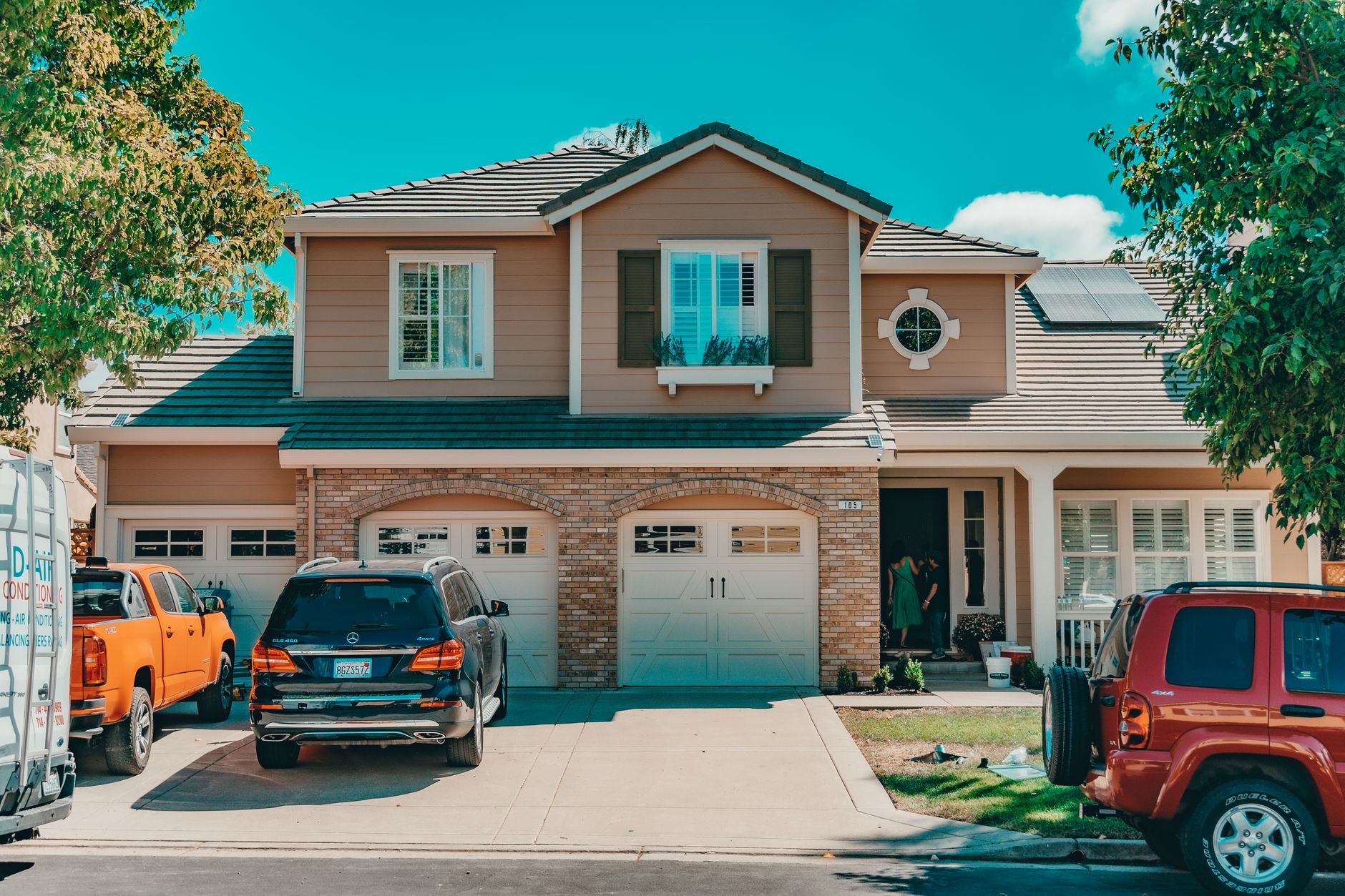 cars near classic suburb house